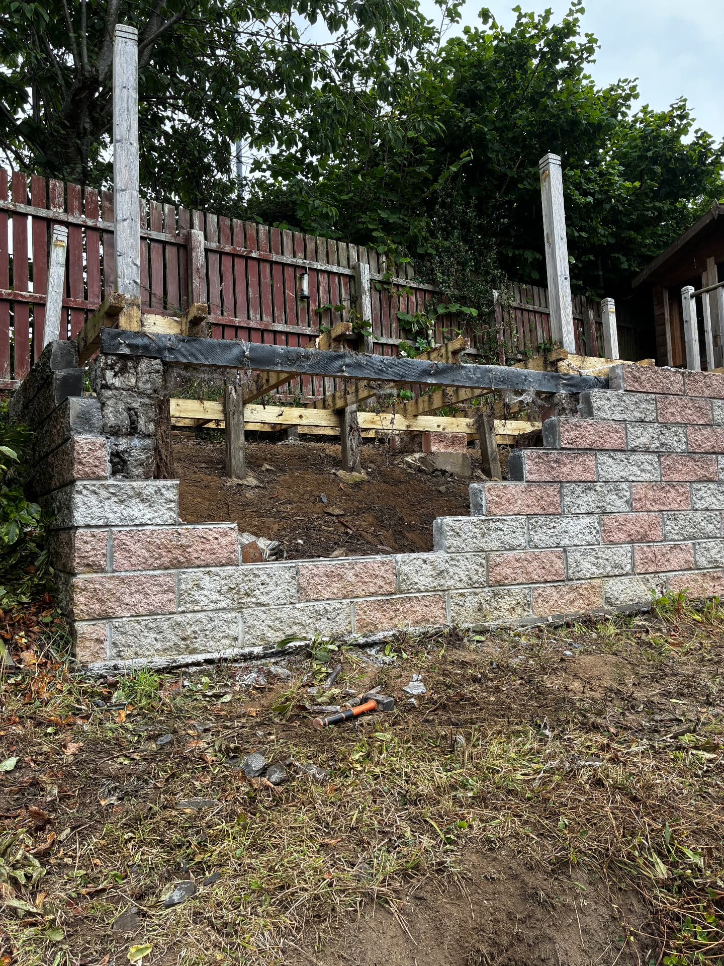 Failing retaining wall being excavated for rebuild by Gillies Construction in Bridge of Don, Aberdeen