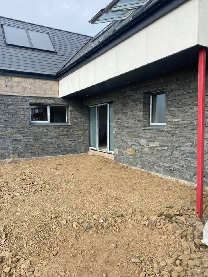 Natural stone cladding on a house exterior by Gillies Construction in Aberdeen